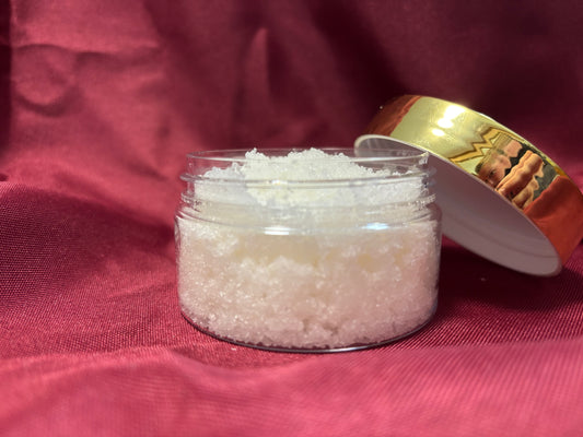 Jar of sugar scrub on a red fabric background